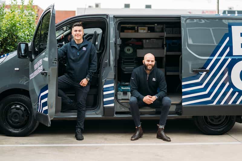 Two men sitting by the Bizcup van outside in Adelaide